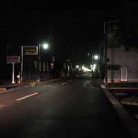 The deserted streets of the town of Namie, Fukushima Prefecture, are seen at night after its evacuation order was lifted in this undated photo. For Fukushima returnees, security a growing concern in deserted towns