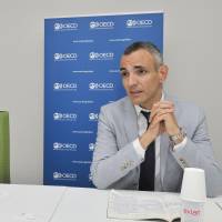 Monika Queisser (left) and Stephane Carcillo of the Organisation for Economic Co-operation and Development speak in an interview in Tokyo on May 29. OECD urges Japan to boost social services for young people, curb ranks of NEETs