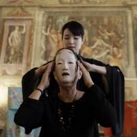 In Rome’s Palazzo della Cancelleria on Saturday, noh actress and performer Isa Takeda shows visitors how to wear a traditional noh mask on the occasion of celebrations marking the 75th anniversary of the establishment of diplomatic relations between the Vatican and Japan. Japan marks 75 years of Vatican ties with noh performance