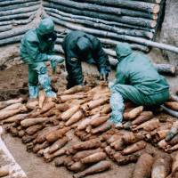 A file photo from 1995 provided by a Japanese government research team shows Japanese chemical weapons left behind at the end of World War II in the northern Chinese district of Haerbaling, Jilin province. Thousands still to go but 46,000 abandoned Japanese chemical arms destroyed in China to date