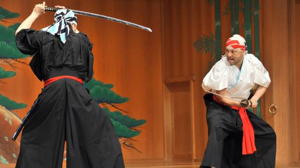 Sharp end: Tetsuro Shimaguchi (right) demonstrates his swordfighting technique at the Kanze Noh Theater in Tokyo’s Ginza district on May 30. Ginza's new noh theater seeks to break down cultural barriers