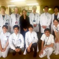 A job well done: Siok Hui Leong is pictured on the last day of her stay at Keio University Hospital, flanked by doctors Taizo Hibi (second from left) and Tsunichi Imai. Dr. Takuya Minagawa crouches second from left on the bottom row, along with nurses Kawata (second from right) and Kawabe (right). Found in translation: At a Japanese hospital, life-saving cancer care and top-class staff