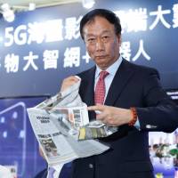 Foxconn Chairman Terry Gou tears up a newspaper bearing a front-page article about Foxconn’s losing bid for Toshiba Corp.’s chip unit on June 22, saying the pursuit isn’t over. Toshiba deal repeats Japan Inc.'s old mistakes