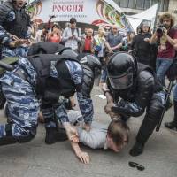 Police detain an anti-Putin protester in Moscow on June 12. Demonstrations organized by opposition leader Alexei Navalny took place across Russia last week to protest corruption. The problem with Oliver Stone and other friends of Vladimir Putin