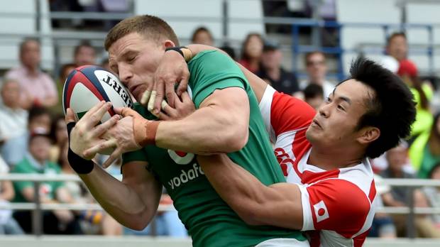 Japan’s Kenki Fukuoka tackles Ireland’s Andrew Conway during Saturday’s test match in Tokyo. Ireland routs Japan for sweep