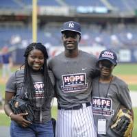 Chris Singleton, seen posing with his sister, Camryn (left), and his brother, Caleb, before a Yankees-Twins game in New York in August 2015, played center field at Charleston Southern University. Cubs draft son of woman killed in 2015 church shooting in South Carolina