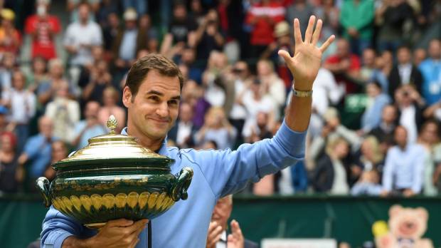 Roger Federer waves to the crowd after winning the Gerry Weber Open on Sunday in Halle, Germany. Federer races past Zverev to claim ninth Halle title
