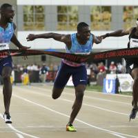 Justin Gatlin (left) reacts as he defeats Christian Coleman (center) in the men’s 100-meter final at the U.S. Track and Field Championships on Friday in Sacramento, California. Mike Rodgers finished sixth. Gatlin outsprints Coleman to capture 100-meter title at nationals