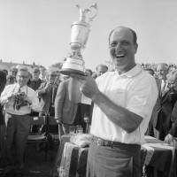 Roberto De Vincenzo holds the Claret Jug trophy after winning the British Open at Hoylake, England, in 1967. De Vicenzo died Thursday at 94. Argentine golf legend De Vicenzo dies at 94