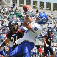 IBM running back Ryo Takagi beats Nojima defensive back Ryosuke Yamaguchi for a 5-yard touchdown reception from Yuki Masamoto on Sunday in the semifinals of the Pearl Bowl. IBM won 27-19. BigBlue, Seagulls advance to Pearl Bowl final