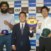 Agleymina player Bikramjit Gill (far left), 3×3 PREMIER.EXE league commissioner Takaaki Nakamura (center) and Dime team owner/player Yusuke Okada pose for photos during Friday’s kickoff news conference for the circuit’s upcoming season in Tokyo. 3x3 PREMIER.EXE hopes to capitalize on game's inclusion in Tokyo Olympics, broaden popularity