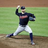 Cleveland starter Corey Kluber pitches against Baltimore in the ninth inning on Monday night. Cleveland's Kluber tosses three-hitter in rout of Baltimore