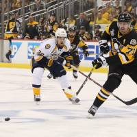 The Penguins’ Evgeni Malkin passes the puck against the Predators in first-period action during Game 2 of the Stanley Cup Final on Wednesday. Penguins storm past Predators in third period, take 2-0 series lead