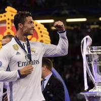 Cristiano Ronaldo celebrates following Real Madrid’s victory in the Champions League final. Madrid becomes first club to retain Champions League title