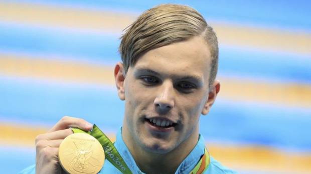 Kyle Chalmers is seen with his 100-meter freestyle gold medal at the 2016 Rio de Janeiro Olympics last August. Rio champ Chalmers OK after heart surgery