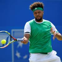Jo-Wilfried Tsonga competes against Gilles Muller in a second-round match at the Aegon Championships in London on Wednesday. In-form Muller eliminates Tsonga