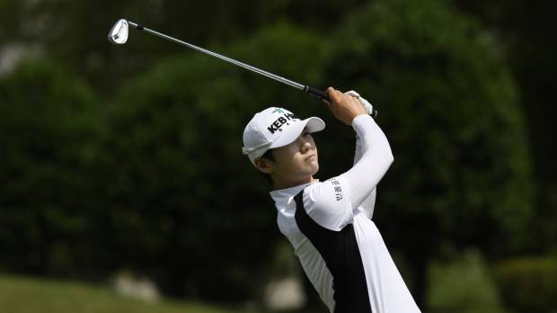 Park Sung-hyun watches her drive on the 11th hole during the first round of the NW Arkansas Championship on Friday in Rogers, Arkansas. Rookie Park capitalizes on six straight birdies to shoot 8-under 63, grab lead