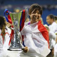 Olympique Lyonnais’ Saki Kumagai celebrates after her team’s triumph in the UEFA Women’s Champions League final on Thursday in Cardiff, Wales. Kumagai helps Olympique Lyonnais capture consecutive Champions League titles