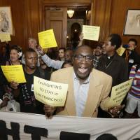Pastor Yul Dorn (center), who is facing eviction due to foreclosure, yells as he and others protest evictions in Mayor Ed Lee’s office at City Hall in San Francisco in 2015. Dorn and his wife expect to join the growing ranks of African-Americans who do not own their homes, a rate that was nearly 30 percentage points higher than that of whites in 2016, according to a report by Harvard University’s Joint Center for Housing Studies. African-Americans seen struggling to own as U.S. housing market recovers