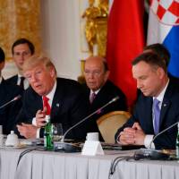 U.S. President Donald Trump talks to Polish President Andrzej Duda as (from left) U.S. Secretary of the Treasury Steven Mnuchin, White House Senior Adviser Jared Kushner and U.S. Secretary of Commerce Wilbur Ross listen during the Three Seas Initiative Summit in Warsaw Thursday. Mnuchin said Sunday there is no plan to raise taxes on the weathy. Treasury chief Mnuchin rules out tax hike on wealthy, shooting down reported Bannon idea