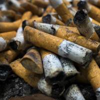 Cigarette butts fill an ashtray on in Centreville, Virginia, last year. Warnings about the dangers of smoking and restrictions on tobacco use have quadrupled worldwide since 2007, but more needs to be done to curb this deadly habit, the U.N. health agency said Wednesday. WHO blasts tobacco industry for blocking anti-smoking moves