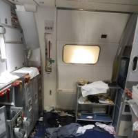This July 7 photo taken by the FBI and released via the U.S. Attorney’s Office in Seattle shows the aftermath of a cabin brawl on Delta Flight 129 from Seattle to Beijing, after authorities say flight attendants struggled with Joseph Daniel Hudek IV, a passenger who lunged for an exit door. The photo was included in a criminal complaint filed July 7. Prosecutors disclosed Thursday that Hudek was indicted on five federal charges; one count of interfering with the flight crew and four counts of assault on an aircraft. Florida man slapped with five federal charges over brawl on Delta Seattle-China flight