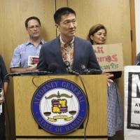 Hawaii Attorney General Douglas Chin speaks at a news conference about President Donald Donald Trump’s travel ban on June 30 in Honolulu. Chin says the scaled-back version of Trump’s travel ban has illogical standards for who should be prohibited from entering the country. Chin questioned why a stepbrother or stepsister should be allowed into the country but not a grandmother. Including grandparents in U.S. travel ban is 'preposterous,' Hawaiian state attorneys say