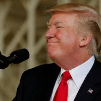 U.S. President Donald Trump participates in the commissioning ceremony of the aircraft carrier USS Gerald R. Ford in Norfolk, Virginia, on Saturday. New al-Shabab video calls Trump a 'brainless billionaire'