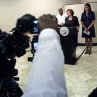 Mayor Betsy Hodges (center) and Assistant Police Chief Medaria Arradondo (left) address the latest developments in the death of Justine Damond Tuesday in Minneapolis. Damond, of Australia, was shot and killed on Saturday by a Minneapolis police officer after she called 911 to report what she believed to be a possible assault. Australian woman called 911 twice before policeman gunned her down from cruiser
