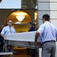 Workers bring a casket to the Dali Theater Museum in Figueres, Spain, on Thursday. Salvador Dali’s eccentric artistic and personal history took yet another bizarre turn Thursday with the exhumation of his embalmed remains in order to obtain genetic samples that could settle whether one of the founding figures of surrealism fathered a daughter decades ago. In surrealist twist, Spanish artist Dali's body is exhumed in paternity lawsuit