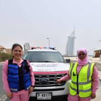 Filipino Dr. Maria Lagbes (left) and a driver stand next to a pink ambulance of the Women Responders team in Dubai on Thursday. Four women, two medics and two drivers are leading the pilot project for a women-only pink ambulance service that aims to expedite medical care by helping patients feel more at ease. Dubai debuts pink female-only ambulances