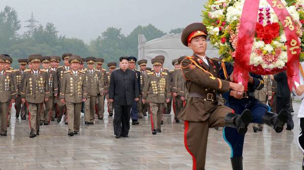 North Korean leader Kim Jong Un (black suit) visits the Fatherland Liberation War Martyrs’ Cemetery in Pyongyang on Thursday. North Korean hacking said to be more focused on making money than on espionage: South Korean report