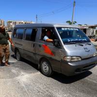 Members from a coalition of rebel groups called Jaish al Fateh, also known as Army of Fatah (Conquest Army), man a checkpoint in Idlib city, Syria, Tuesday. Al-Qaida-linked jihadis open fire on protesters in Idlib: monitor