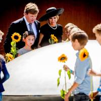 Dutch King Willem-Alexander and his wife, Queen Maxima, attend an event to unveil a national monument to commemorate the victims of the Malaysia Airlines Flight MH14 crash in Ukraine in 2014 in Vijfhuizen, Netherlands, on Monday. Three years on, families honor loved ones lost on downed Malaysia Airlines Flight MH17