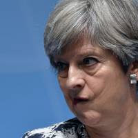 British Prime Minister Theresa May addresses a news conference on the second day of the Group of 20 Summit in Hamburg, Germany, on Saturday. Weakened May appeals to opponents to help deliver Brexit success