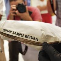 The Apollo 11 Contingency Lunar Sample Return Bag used by Neil Armstrong is displayed at Sotheby’s in New York on July 13. Moon dust heading for auction after galactic court battle