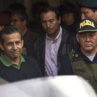 Former Peruvian President Ollanta Humala (left) is escorted out of Lima’s Palace of Justice to Barbadillo Prison, where ex-President Alberto Fujimori is serving time, on Friday. Old foes, former Peruvian leaders Humala and Fujimori now incarcerated at same prison