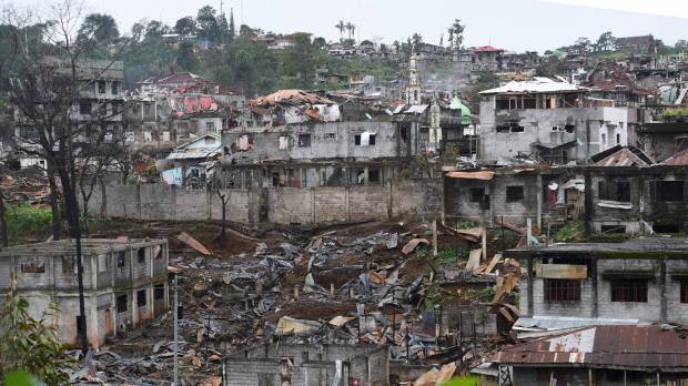 Destroyed buildings are seen from a government sniper’s position on the front-line of the battle against Islamic State-linked militants in the Philippine city of Marawi on Saturday. Islamic State galvanized in Asia by Philippine city siege, report says