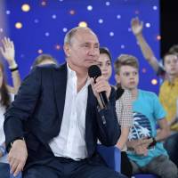 Russian President Vladimir Putin speaks during the “A Grown-up Conversation with Vladimir Putin” TV show held at the Sirius educational center for gifted children in Sochi, Russia, on Friday. Putin tries to woo Russian teens with live TV show
