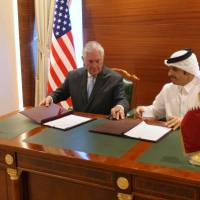 Qatar’s foreign minister, Sheikh Mohammed bin Abdulrahman al-Thani, and U.S. Secretary of State Rex Tillerson sign a memorandum of understanding in Doha Tuesday. Tillerson inks apparently symbolic anti-terror deal with Qatar in bid to end row with its U.S. allies