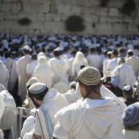 Jewish men pray in May at the Western Wall, the holiest place where Jews can pray, in Jerusalem’s Old City. Israel’s rabbinical authorities have compiled a list of overseas rabbis whose authority they refuse to recognize when it comes to certifying the Jewishness of someone who wants to get married in Israel. The list, obtained by The Associated Press, includes a number of prominent Orthodox rabbis, and is another sign of a deepening rift between overseas Jewish communities and Israeli religious authorities. Israeli list of unrecognized American rabbis hit for lack of explanation, seen furthering rift