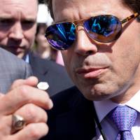 White House Communications Director Anthony Scaramucci talks to the media outside the White House in Washington Tuesday. Trump message manager Scaramucci set to 'fire everybody' to halt White House leaks to press