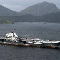 China’s aircraft carrier, the Liaoning, sails into Hong Kong July 7. U.S. Navy destroyer monitored Chinese carrier in Taiwan Strait: report