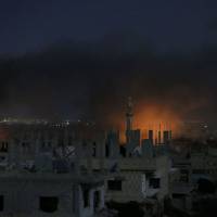 Smoke and flames rise from buildings following a reported government strike on a rebel-held area in Syria’s southern city of Daraa late on July 3. The Syrian army on July 4 unilaterally announced a halt to fighting in the country’s south that would coincide with a new round of peace talks in the Kazakh capital Astana. Trump seeks more cooperation with Russia as Syria cease-fire takes effect