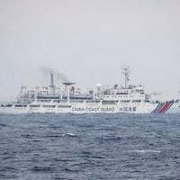 One of two Chinese coast guard ships is seen Monday off Aomori Prefecture. It was the first confirmed entry by Chinese government vessels into the area. Two Chinese coast guard vessels intrude into Japanese waters off Aomori Prefecture