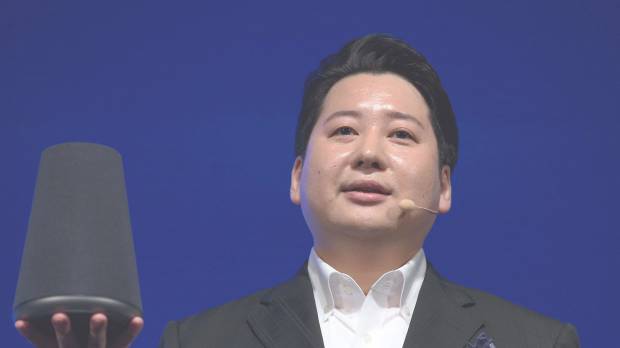 Jun Masuda, chief strategy and marketing officer of Line Corp., holds the company’s Wave smart speaker during the company’s annual strategy briefing in Tokyo on June 15. Smart speakers powered by voice agents seen ushering in era of AI