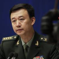 Chinese defense ministry spokesman Wu Qian speaks at a news conference in Beijing on Monday. China is warning India not to underestimate its determination to safeguard what it considers sovereign territory amid a standoff over a contested region in the Himalayas. What China's Himalayan warmongering reveals