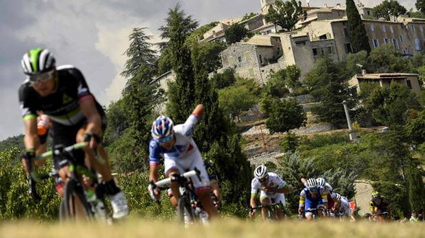Norway’s Edvald Boasson Hagen (left) rides in a breakaway near a village during the 19th stage of theTour de France from Embrun to Salon-de-Provence on Friday. Hagen won the stage. Froome remains in control heading into last two stages