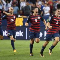 Jordan Morris (right) of the United States celebrates scoring an 88th-minute goal against Jamaica in the CONCACAF Gold Cup final in Santa Clara, California, on Wednsday. The U.S. defeated Jamaica 2-1. Morris lifts U.S. past Jamaica in Gold Cup final