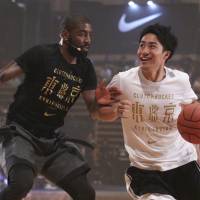 Cleveland Cavaliers superstar Kyrie Irving takes on a young Japanese player during Friday’s Clutch Bucket event in Tokyo. Cavs' Irving fired up about 2020 Games